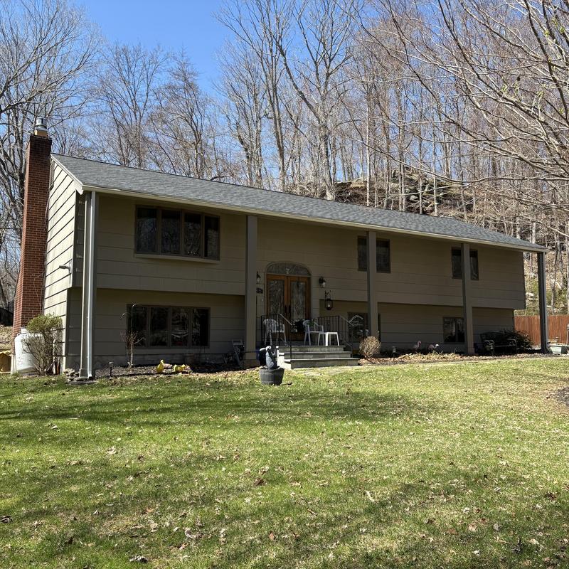 Roof sheathing and shingle replacement on home exterior