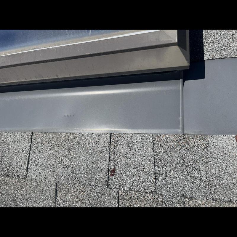 Roof flashing and asphalt shingles with nail repair