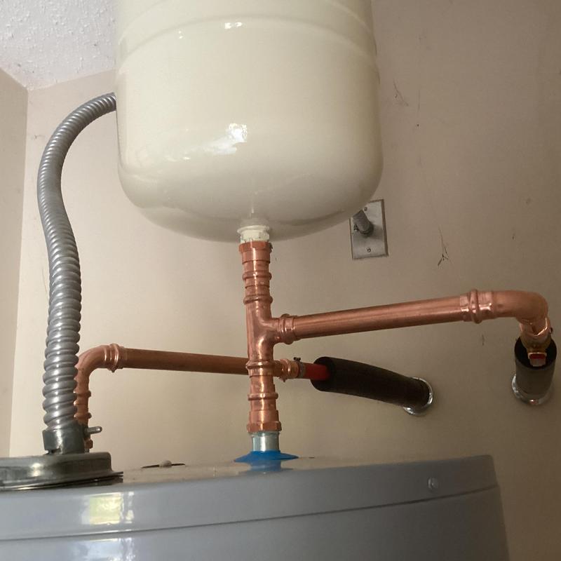 Copper piping on water heater expansion tank installation