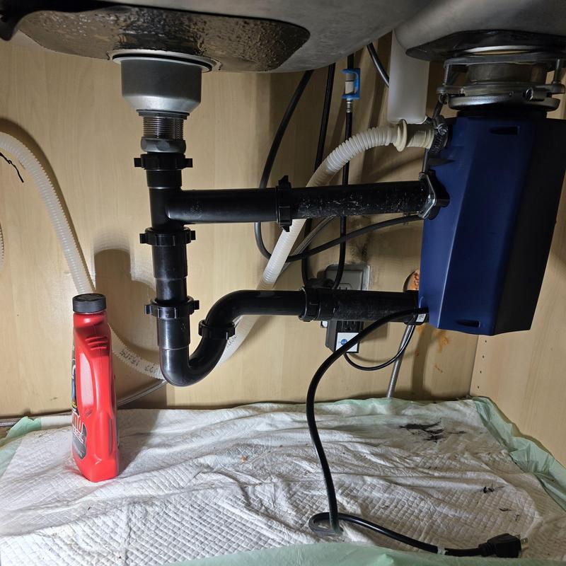 Garbage disposal and drain piping under sink
