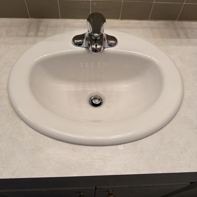 Bathroom sink with Moen faucet installed and tested