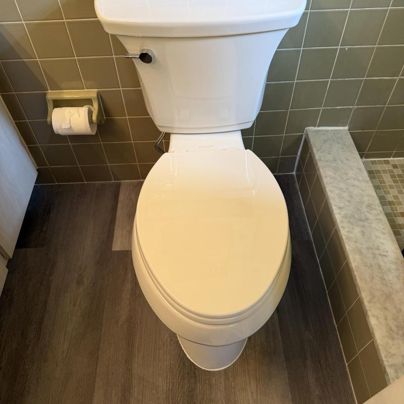 Kohler toilet installation in bathroom corner