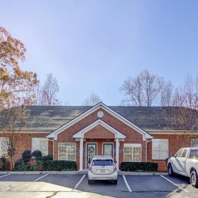 Office building roof with wind and storm damage in Acworth