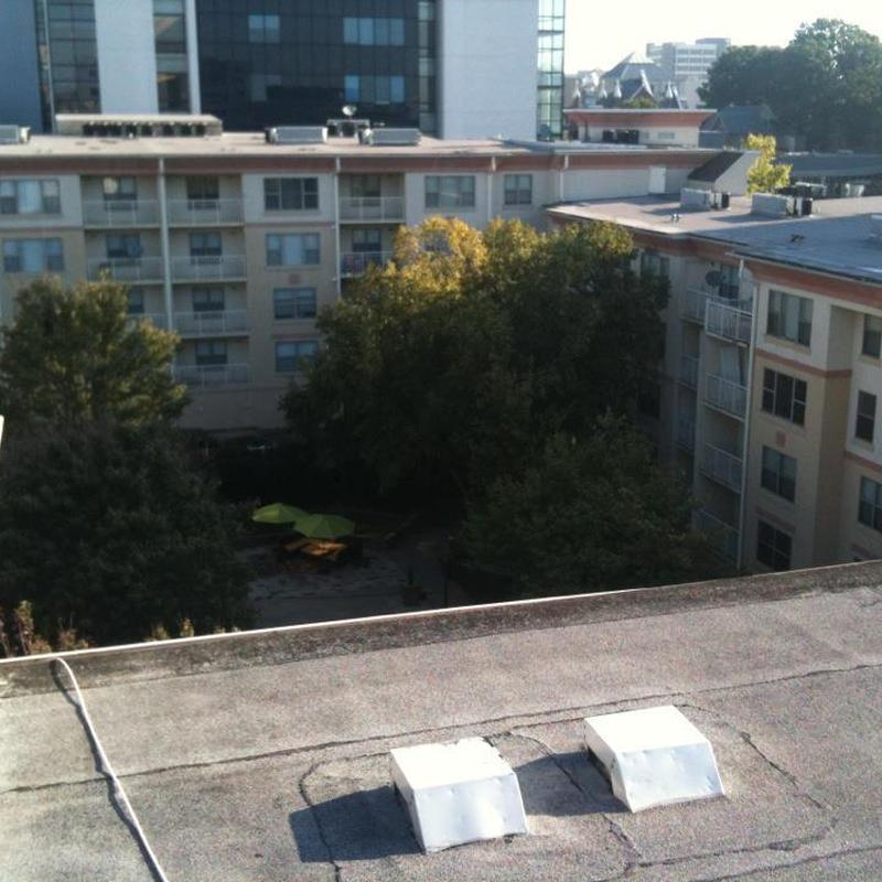 Flat roof ventilation units on apartment complex roof