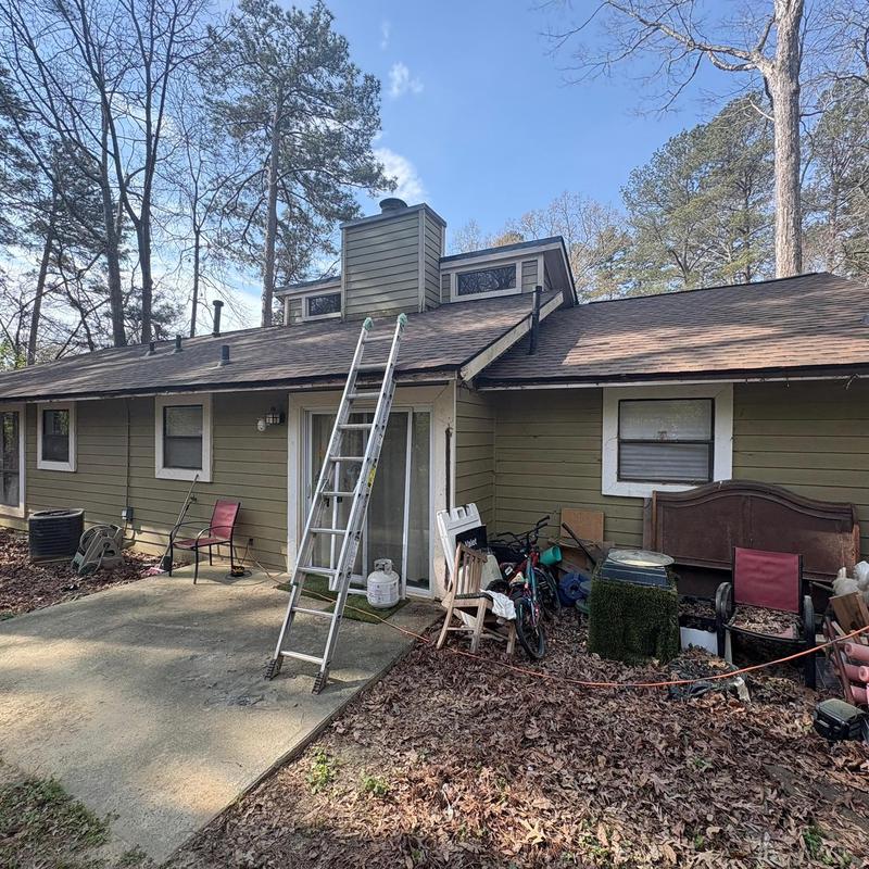 Asphalt shingle roof with ladder and backyard area