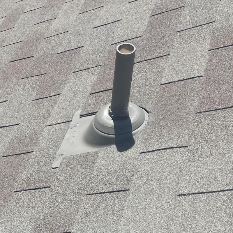 Vent pipe flashing with sealed roof shingles