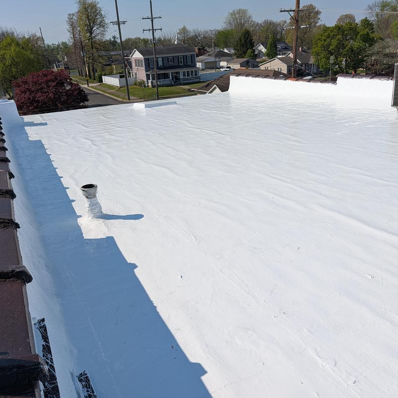Elastomeric coating on flat commercial roof