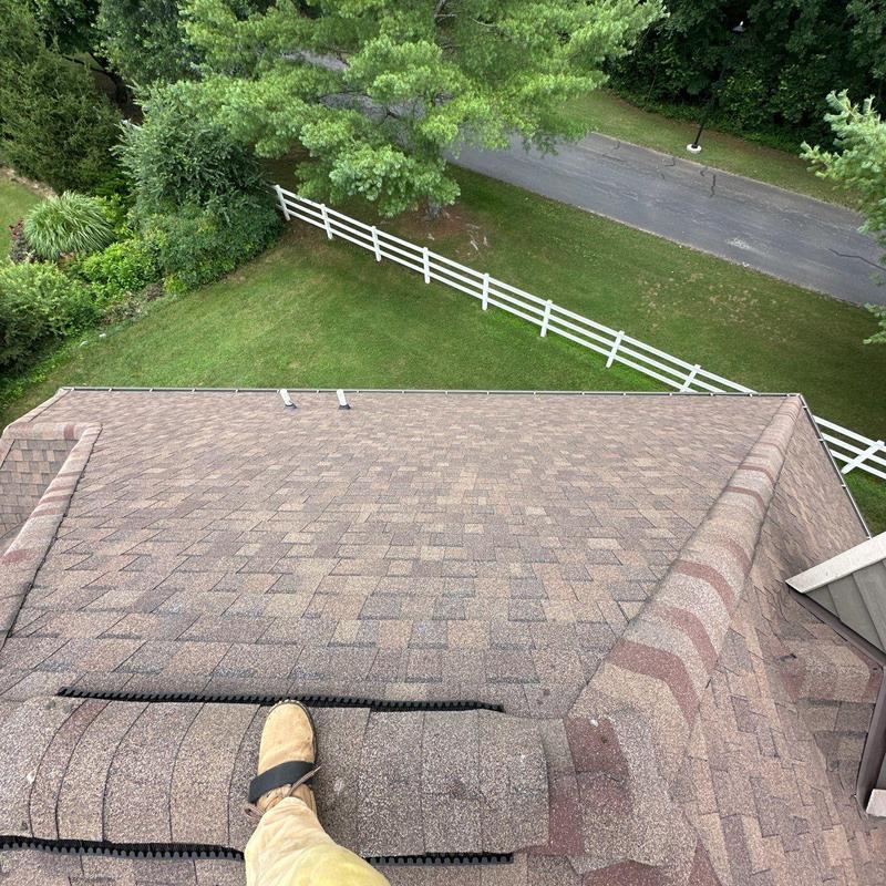 Asphalt shingle roof with ridge vent inspection