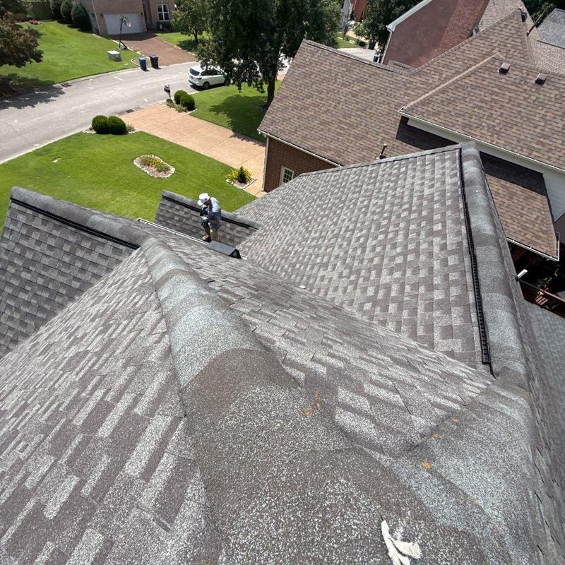 Asphalt shingle roof with hail damage inspection