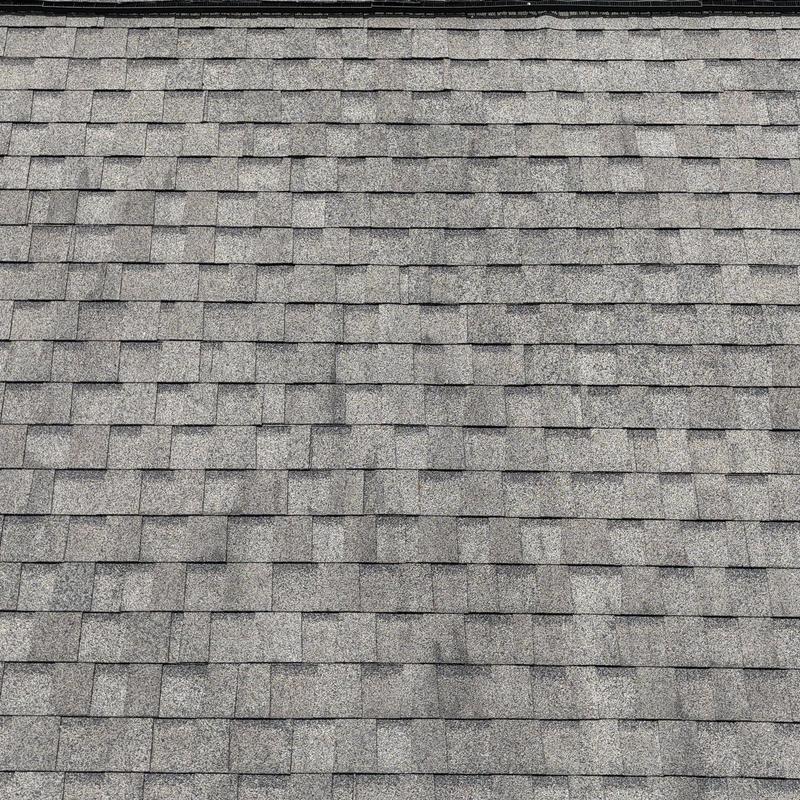Asphalt shingle roof with visible hail damage marks