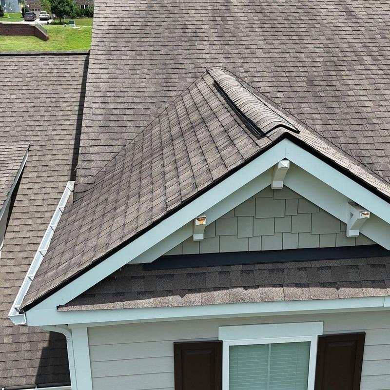 Asphalt shingle roof with hail damage inspection