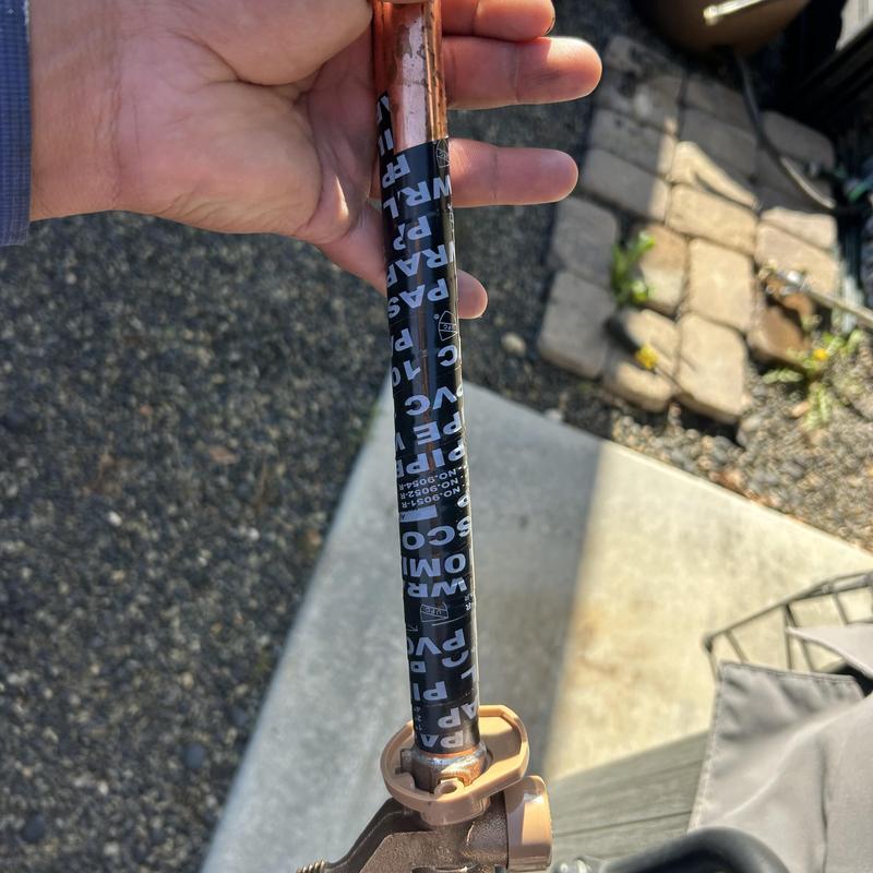 Hose bib with wrapped copper pipe, outdoor plumbing repair Hose bib with wrapped copper pipe, outdoor plumbing repair