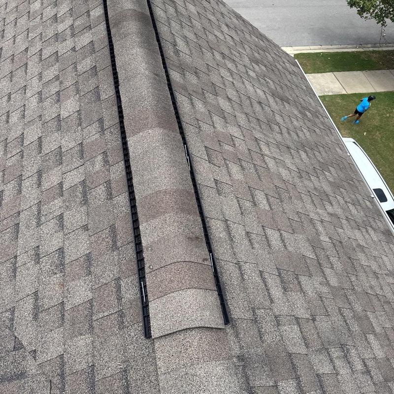 Asphalt shingle roof with ridge vent installation