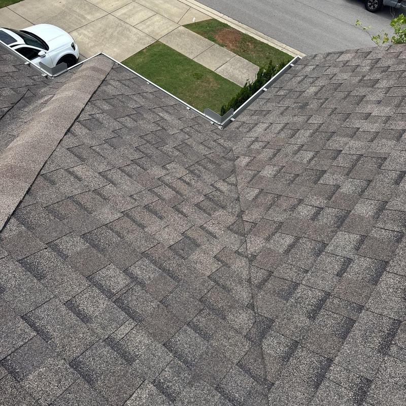 Asphalt shingle roof with hail damage inspection