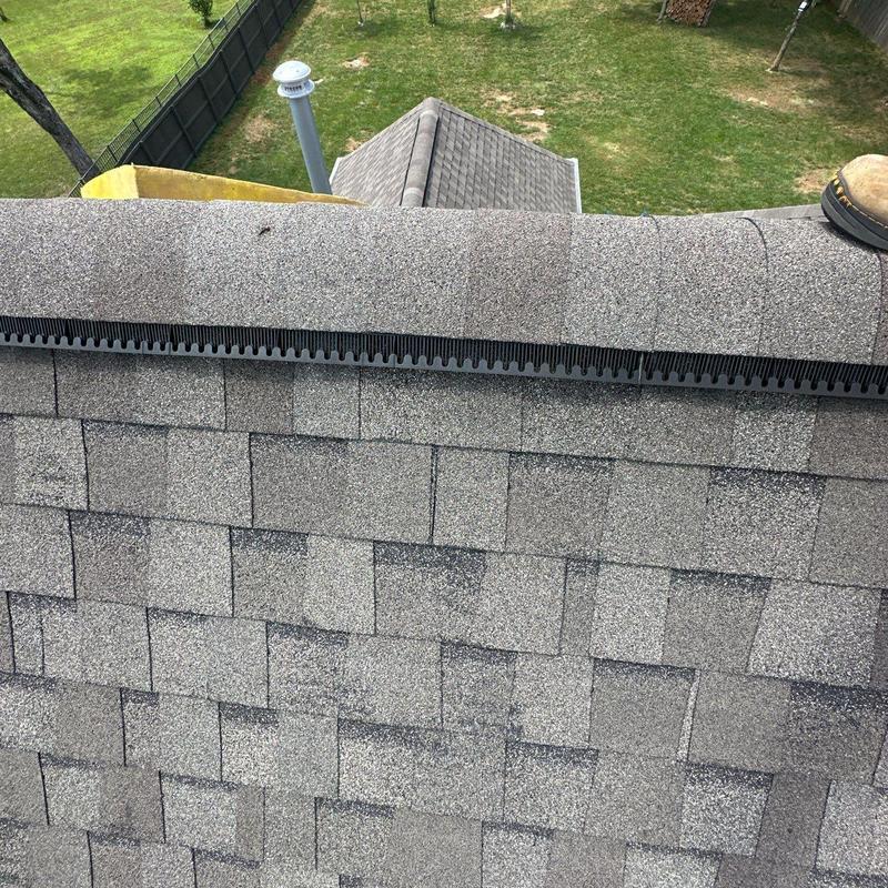 Asphalt roof shingles with hail damage and wear