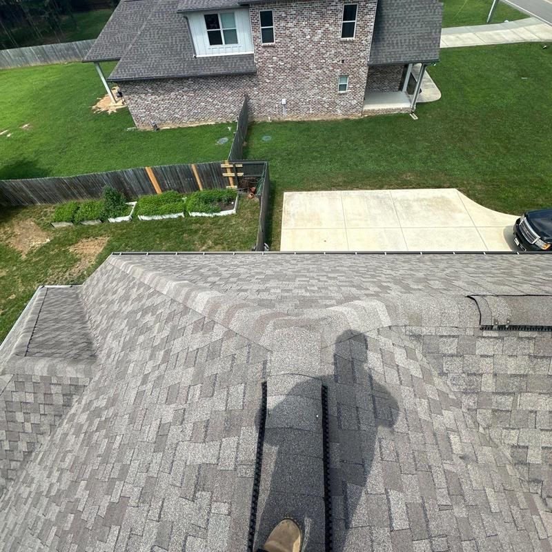 Asphalt shingle roof with ridge vent inspection