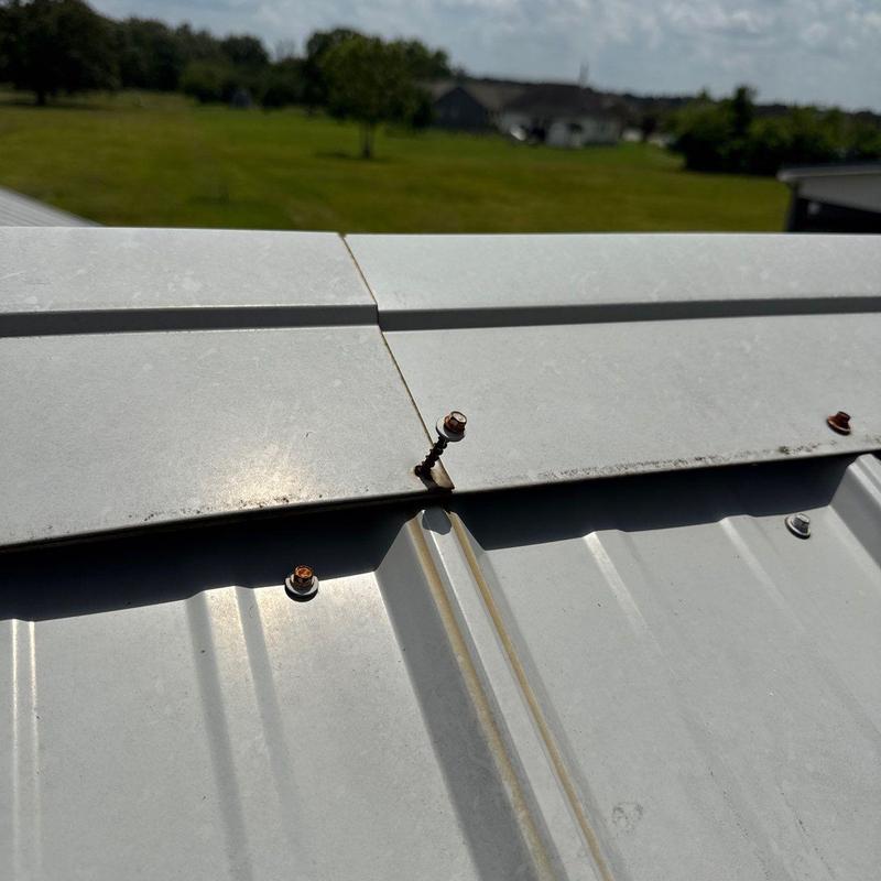 Metal roof screws rusting and loosening on panel edge