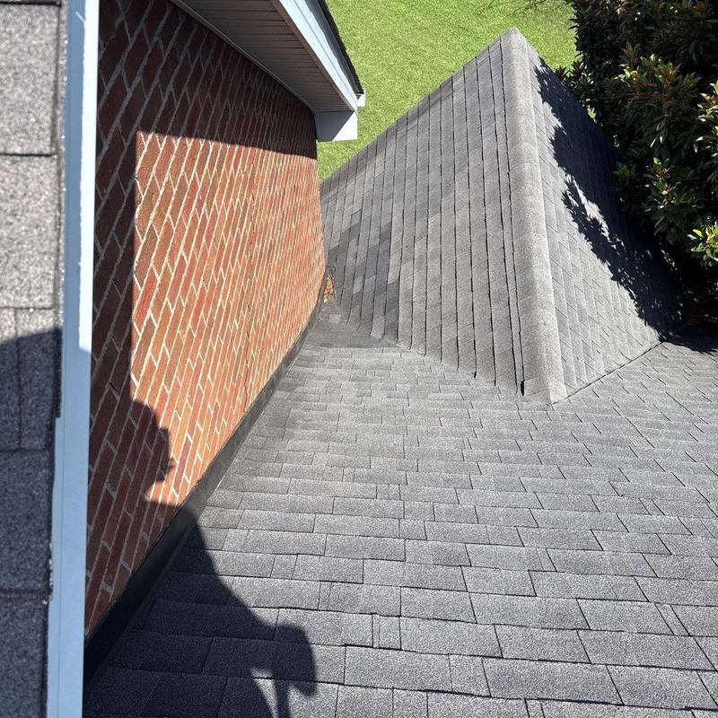 Architectural shingle roof with chimney flashing and valley