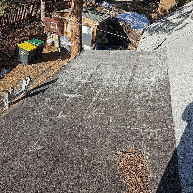 Flat roof with markings and debris on surface