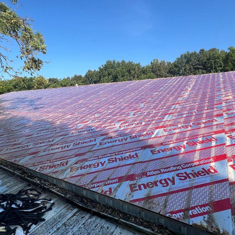 Roof underlayment with hail damage on commercial roof