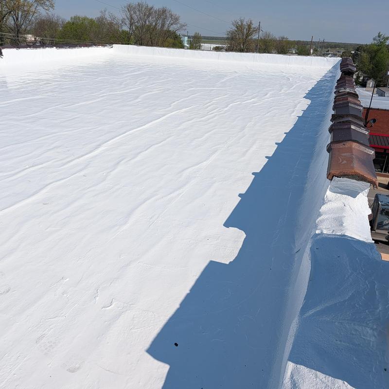 Elastomeric flat roof restoration with white coating