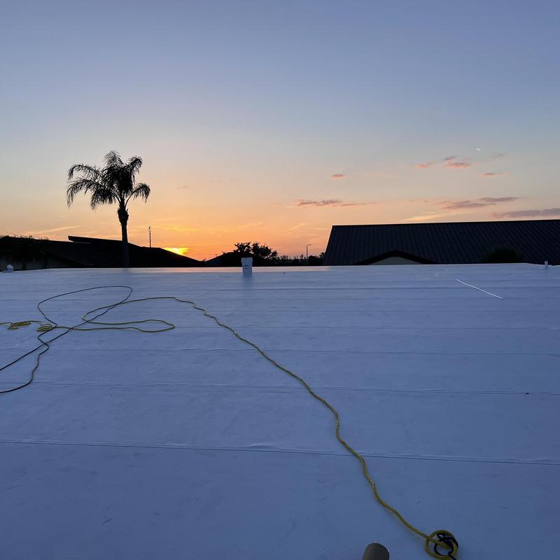 TPO membrane roofing on community center at sunset