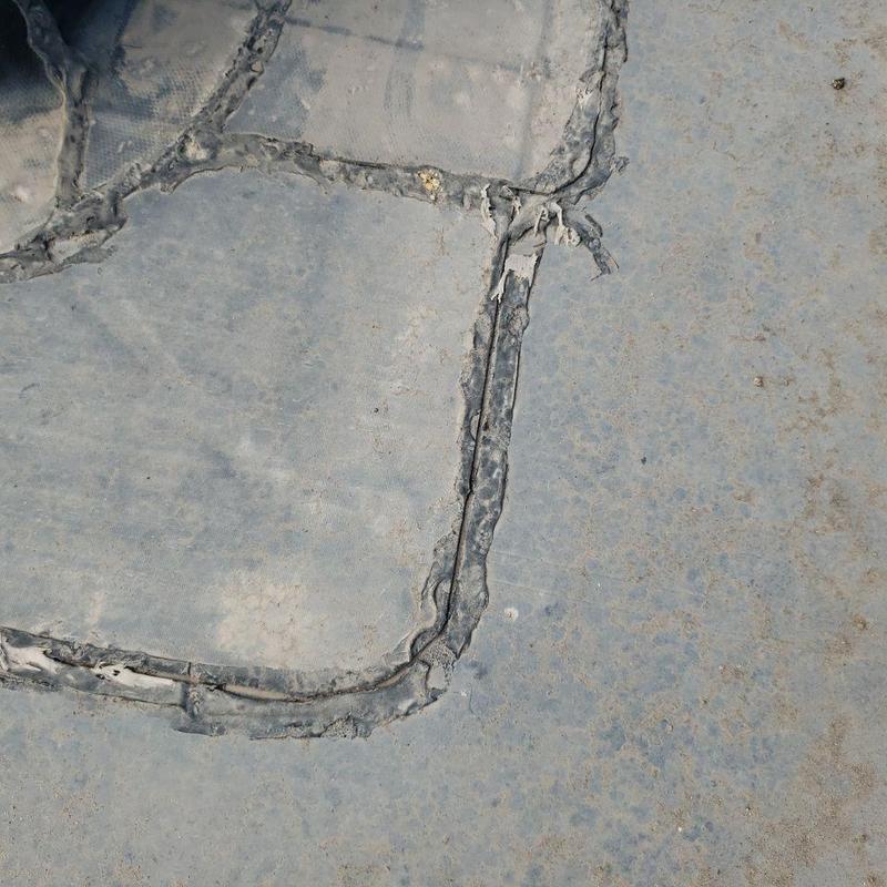 EPDM flat roof deteriorated seams close-up