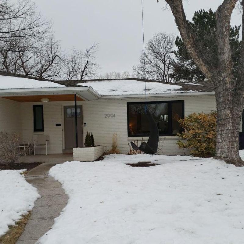 TPO flat roof with snow cover and leak inspection