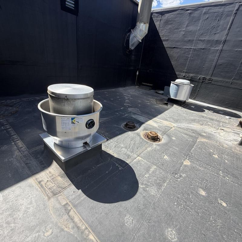 Rooftop exhaust fans on commercial building roof