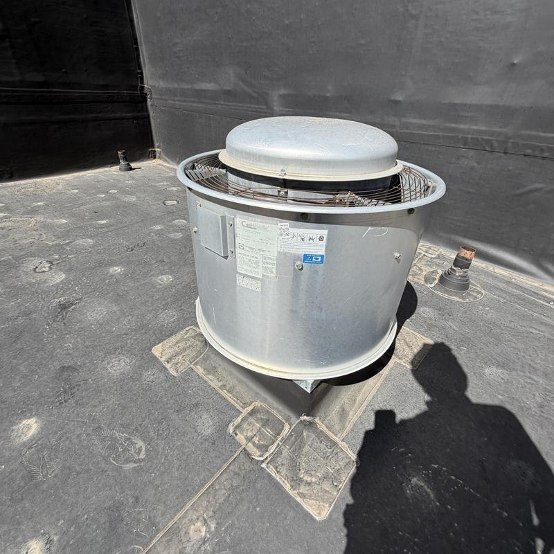 Roof exhaust fan on flat commercial roof in Colorado Springs