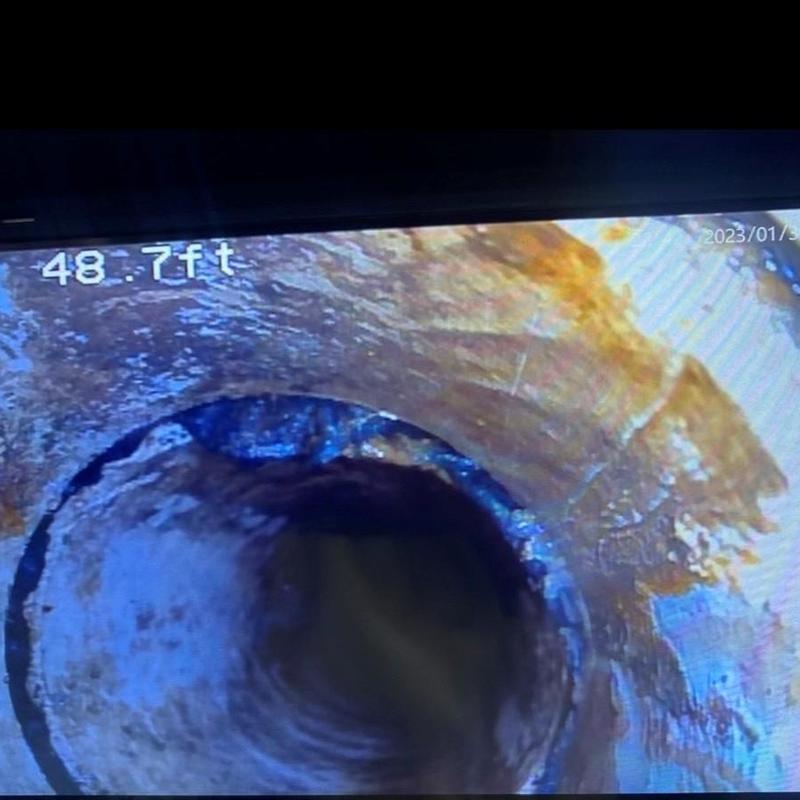 Cast iron sewer pipe interior corrosion at 48.7 ft