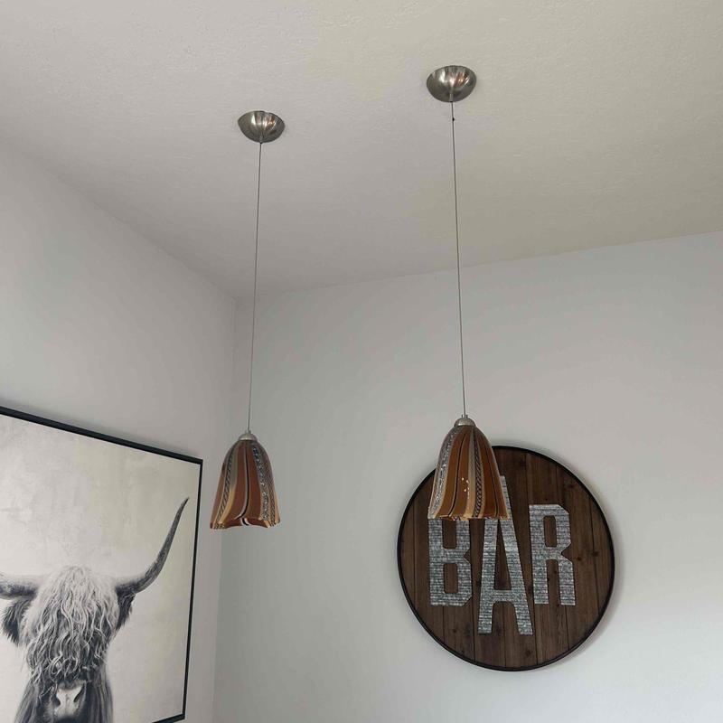 Pendant light fixtures over pool table and bar area