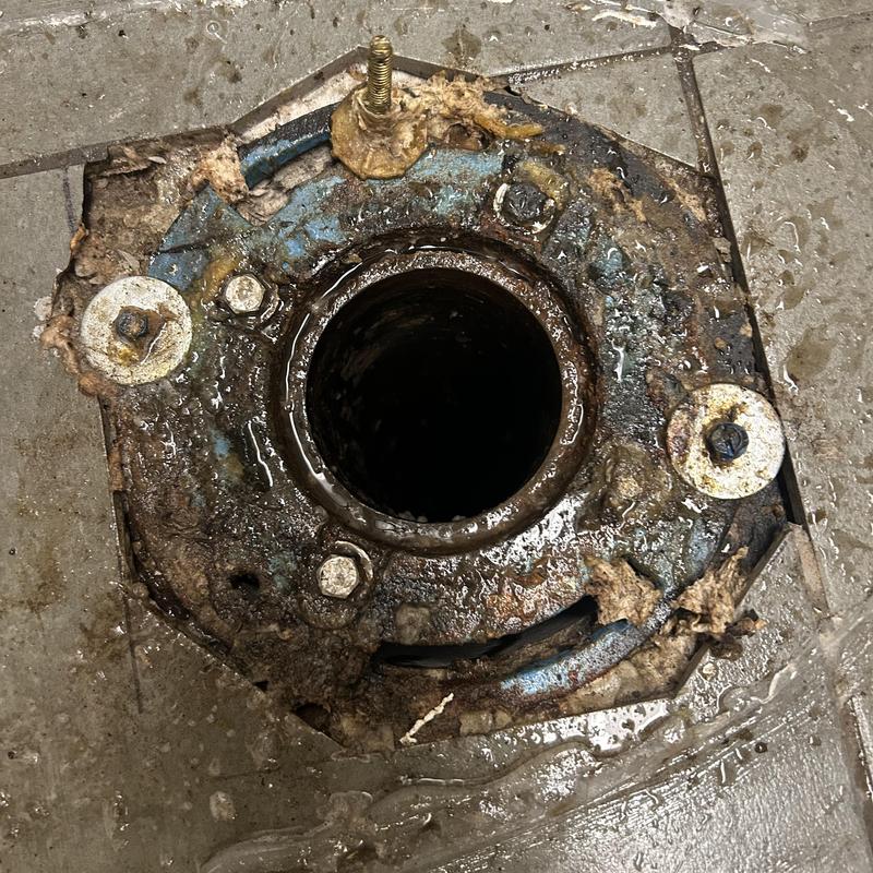 Toilet flange corroded and exposed on bathroom floor Toilet flange corroded and exposed on bathroom floor