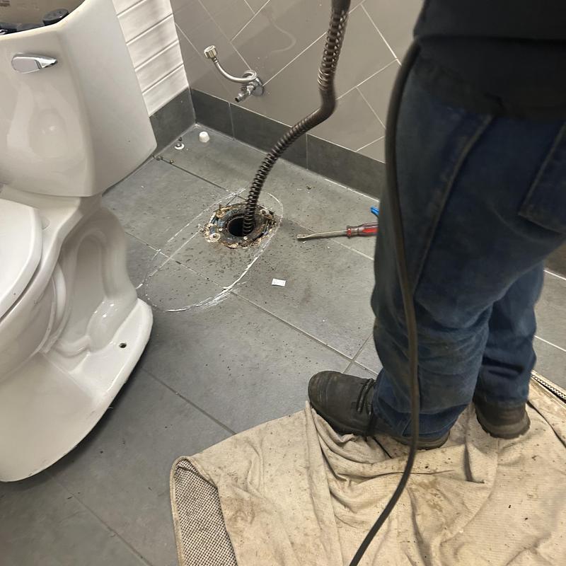 Toilet flange and main drain line cleaning with snake tool Toilet flange and main drain line cleaning with snake tool