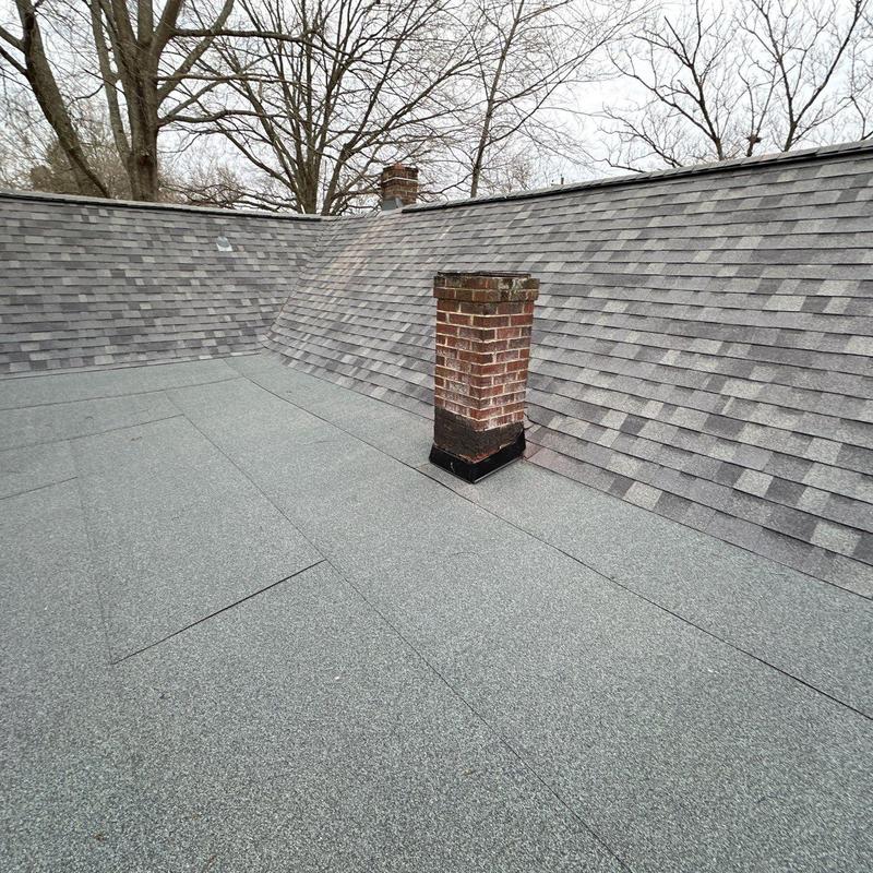 Two ply modified bitumen roofing with chimney