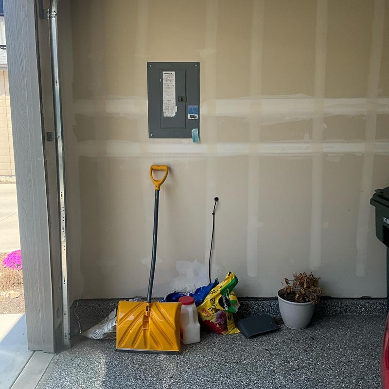 Electrical breaker panel mounted on garage wall Electrical breaker panel mounted on garage wall
