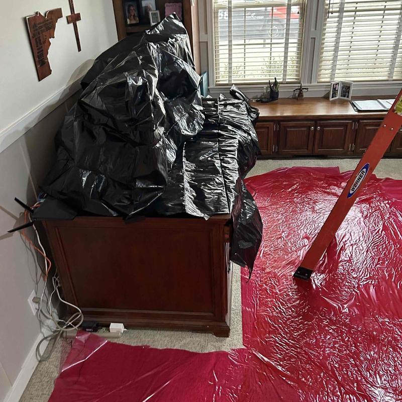 Can lights installation with ladder and drop cloths Can lights installation with ladder and drop cloths