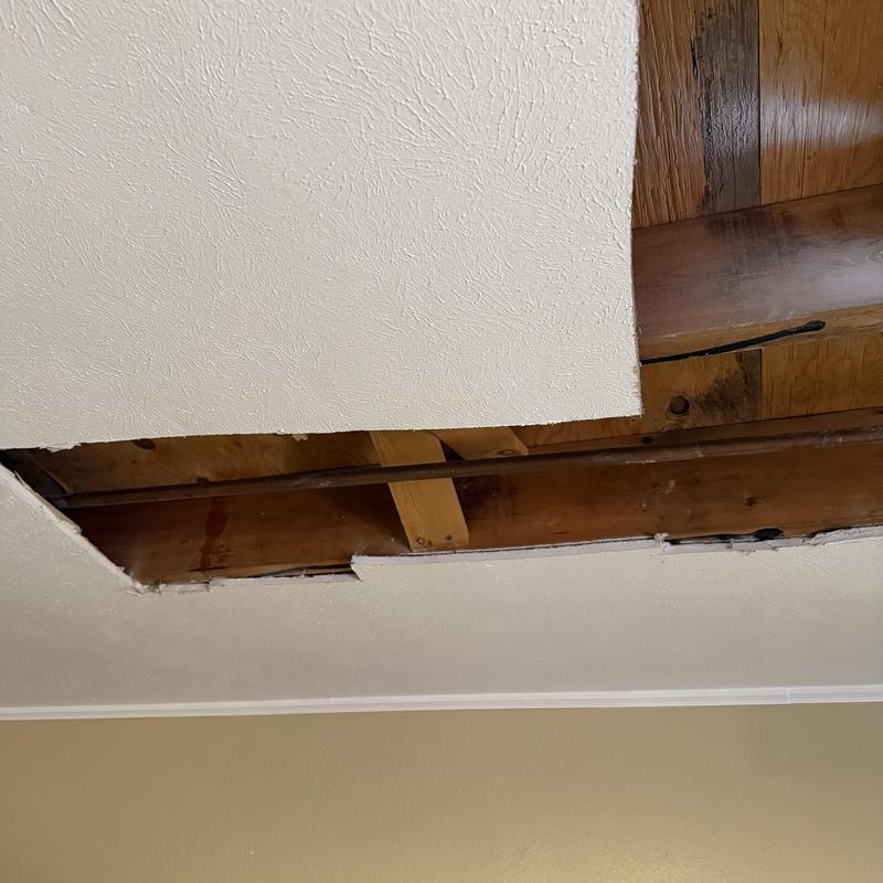Copper water pipe with partial ceiling removed
