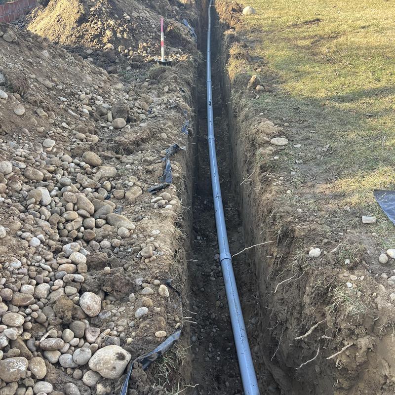 Sewerline installation in deep trench from home to city line Sewerline installation in deep trench from home to city line