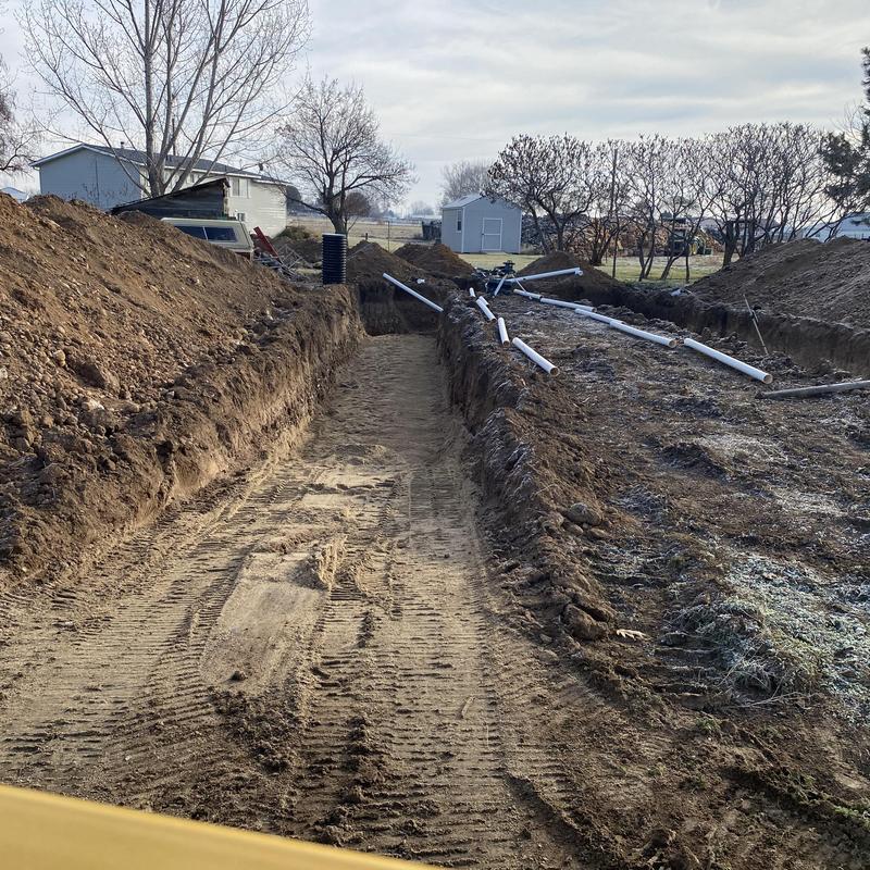 Septic drain field trench excavation and pipe layout Septic drain field trench excavation and pipe layout