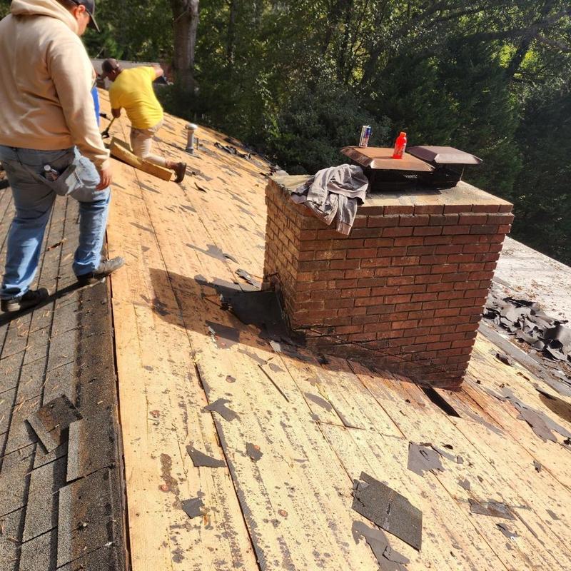 Wood roof decking removal around brick chimney