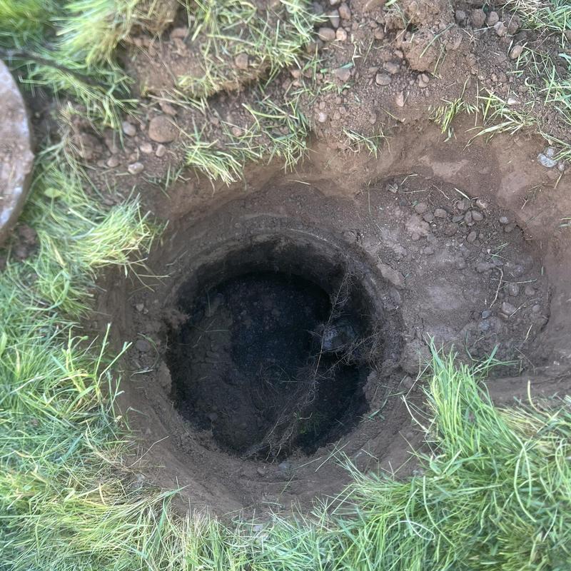 Septic tank inlet excavation and lid exposure hole Septic tank inlet excavation and lid exposure hole