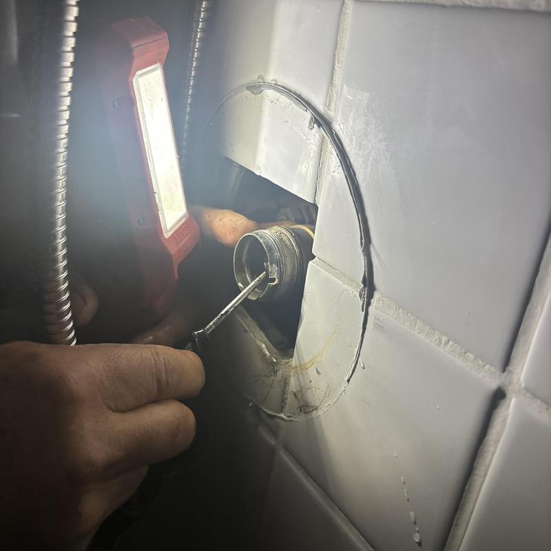 Shower valve seat and spring replacement in wall cavity