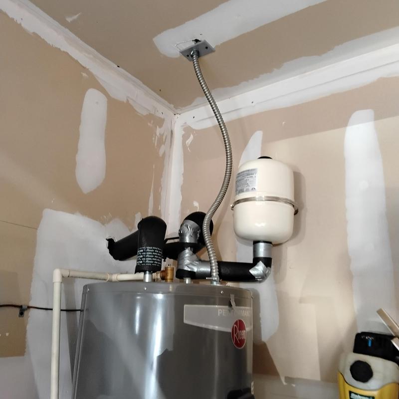 Water heater with expansion tank and vent pipes