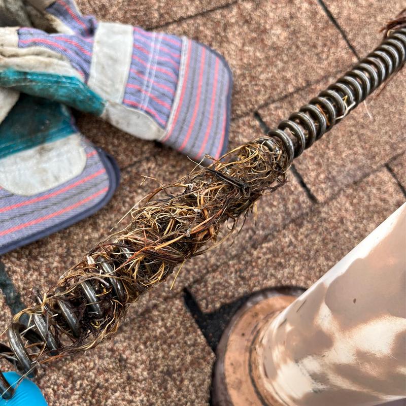 Main sewer line auger with root blockage removed