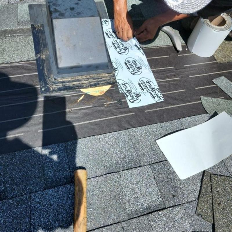 Dryer roof vent flashing installation on shingle roof