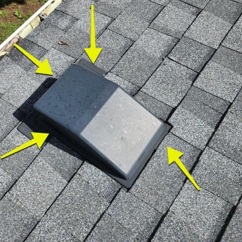 Dryer roof vent with flashing on asphalt shingles