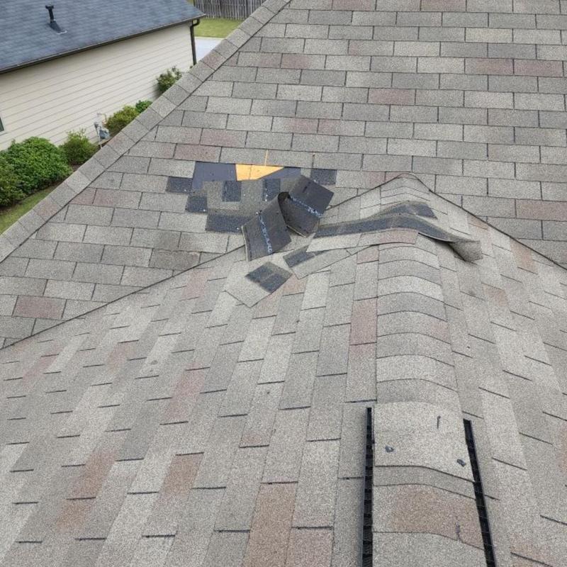 Storm damaged shingles removal and replacement on roof