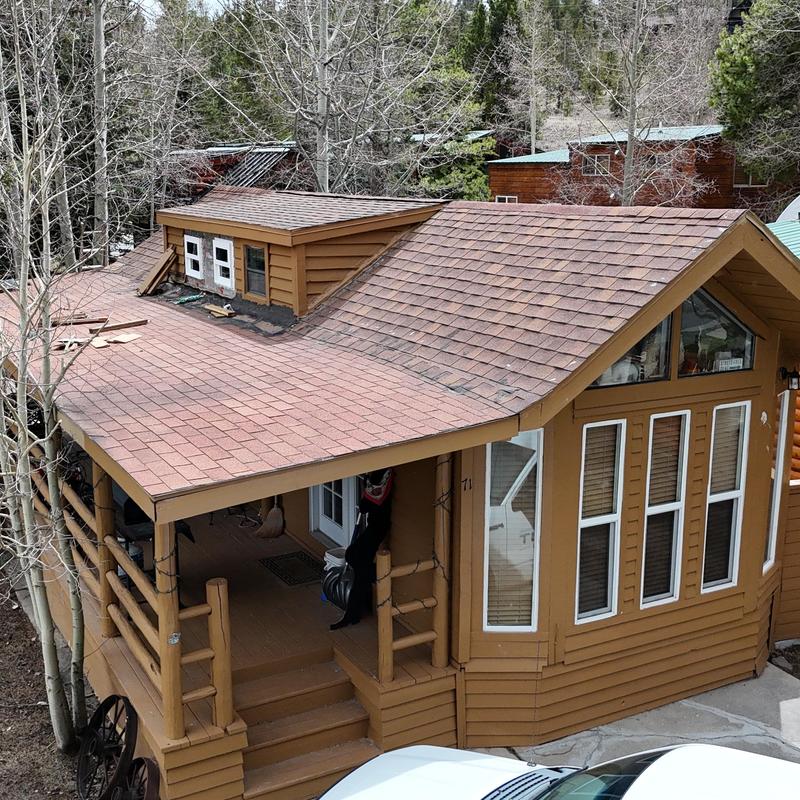 Asphalt shingle roof with dormer on mountain cabin