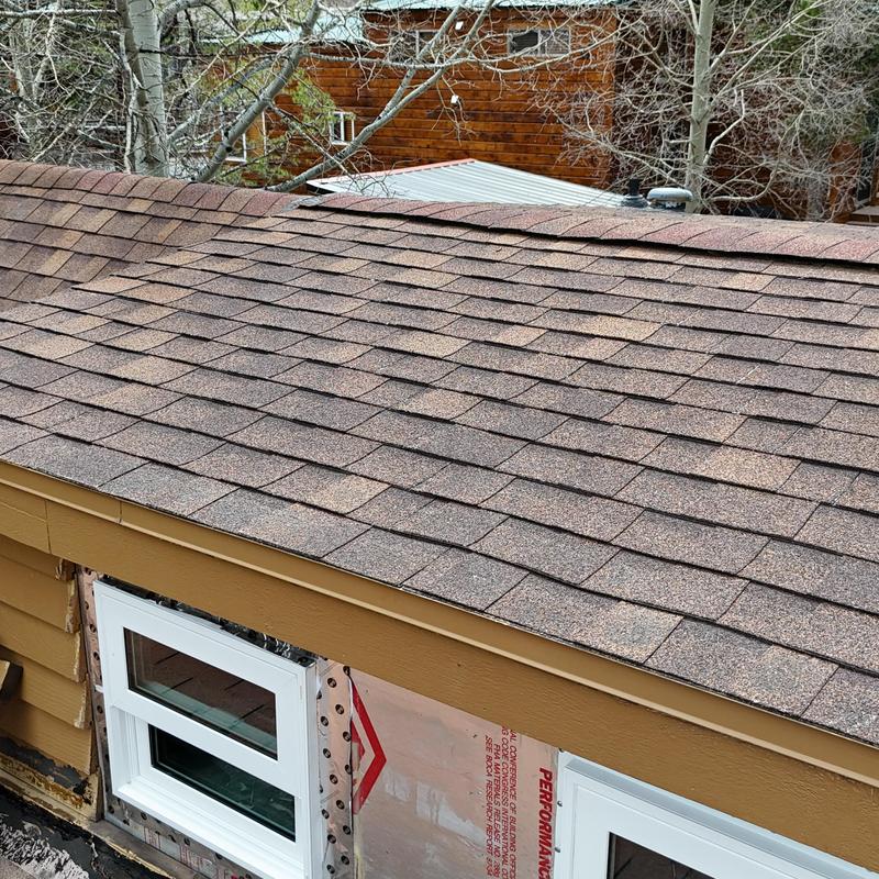 Asphalt shingle roof with new window installation